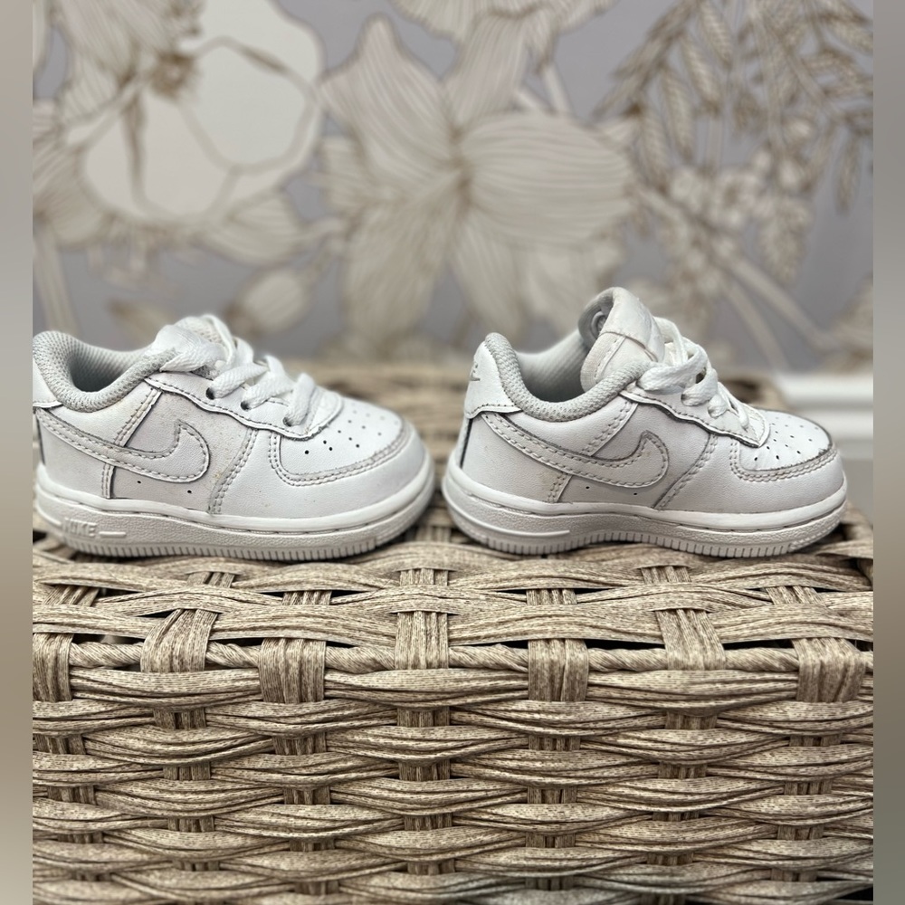Nike toddler shoes in white. A few stains on them that I didn't try to get out.